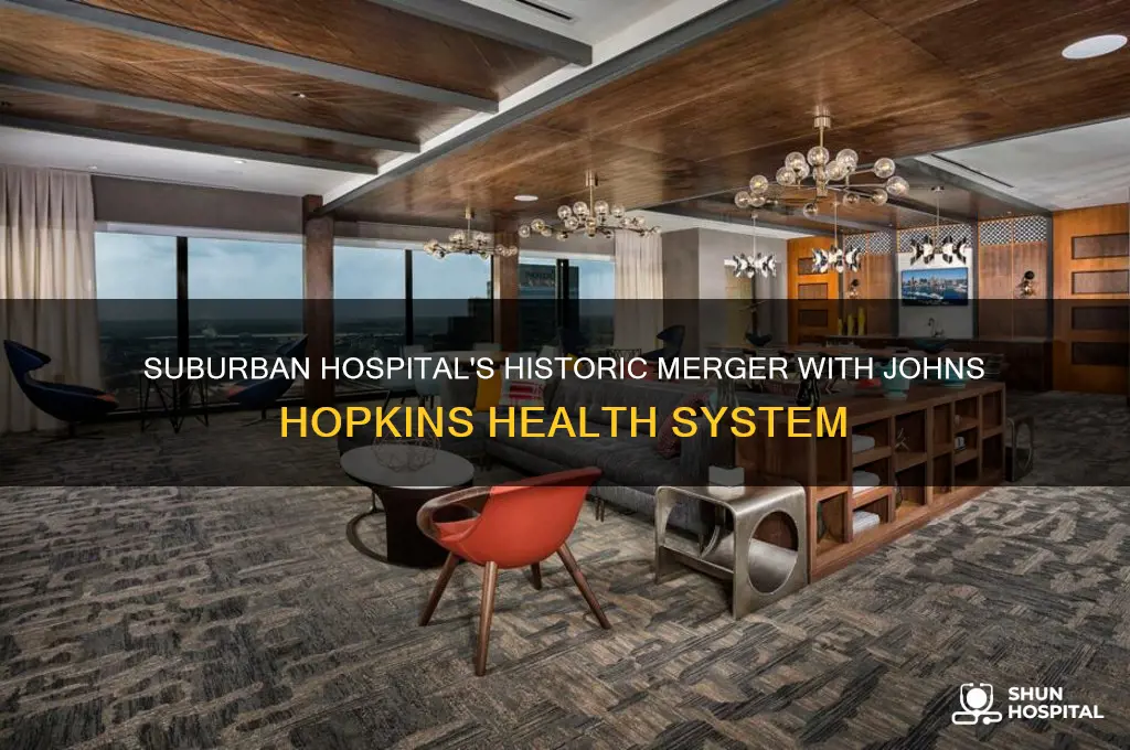 when did suburban hospital health system merge with johns hopkins